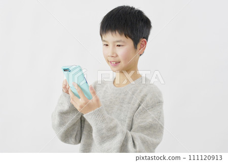 Boy using smartphone, white background 111120913