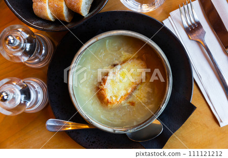 Onion soup with slice of toasted bread 111121212
