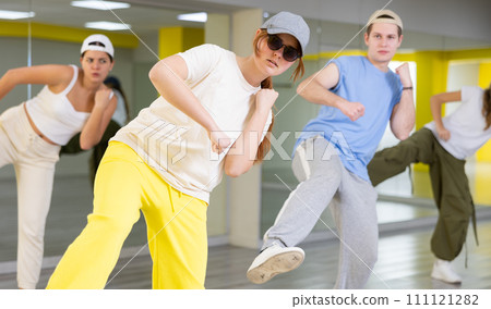 Dance group teaches hip hop dance in dance studio Dance group teaches hip hop dance in dance studio 111121282