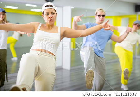 Young girl training breakdance Footwork moves in dance hall 111121538