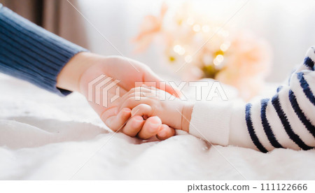 Parent and child holding hands 111122666