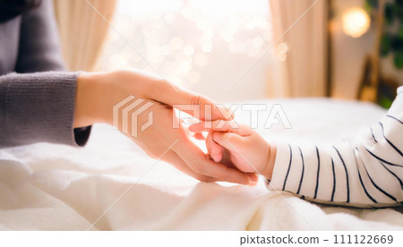 Parent and child holding hands 111122669