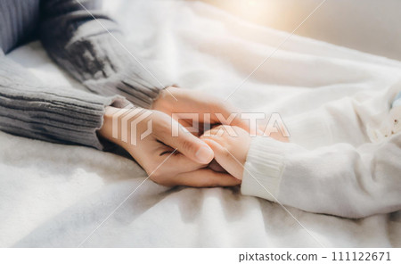 Parent and child holding hands 111122671