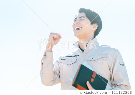 Young male engineer with guts pose Young male engineer with guts pose 111122898