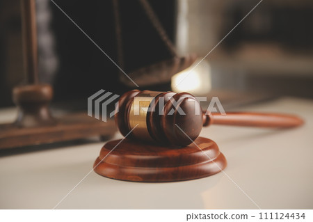 image of judge's hammer, scales lady of justice, law book, laptop computer and contract documents with pen concept of law and justice. 111124434