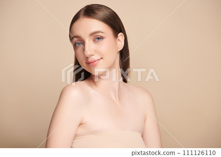 Beautiful young woman with clean fresh skin on beige background, Face care, Facial treatment, Cosmetology, beauty and spa, women portrait. 111126110