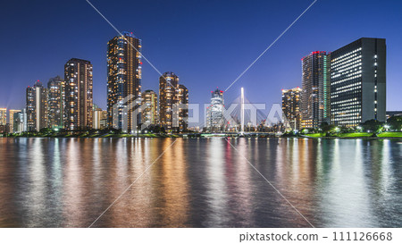 Night view of Tsukudajima's high-rise apartment complex and Chuo Bridge seen from Sumida River Terrace [Chuo Ward, Tokyo] 111126668