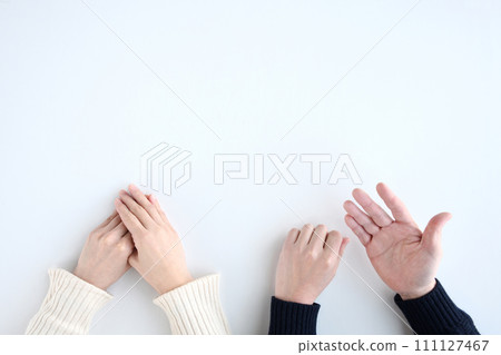 hands of men and women talking 111127467