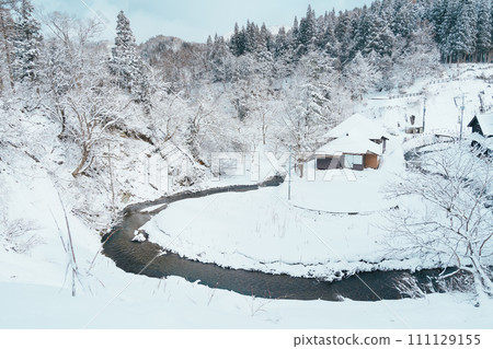 Beautiful view of Ginzan Onsen village with snow fall in winter season is most famous Japanese Hot Spring in Yamagata, Japan. Beautiful view of Ginzan Onsen village with snow fall in winter season is most famous Japanese Hot Spring in Yamagata, Japan. 111129155