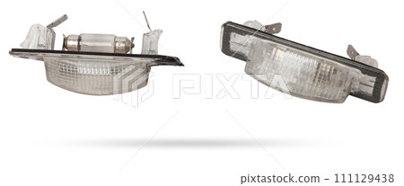 spare part from the car on a white isolated background is a cover for the illumination of a standard sign on the trunk lid for replacement and repair. Spare parts catalog. spare part from the car on a white isolated background is a cover for the illumination of a standard sign on the trunk lid for replacement and repair. Spare parts catalog. 111129438