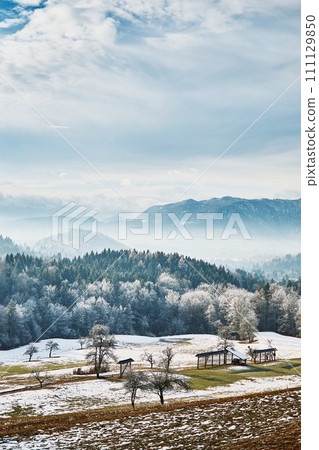 Winter landscape of field with mountains Winter landscape of field with mountains 111129850