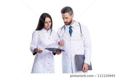 busy doctor and internist wear white coat and noting ehealth. internist and doctor busy doctor and internist wear white coat and noting ehealth. internist and doctor 111129945