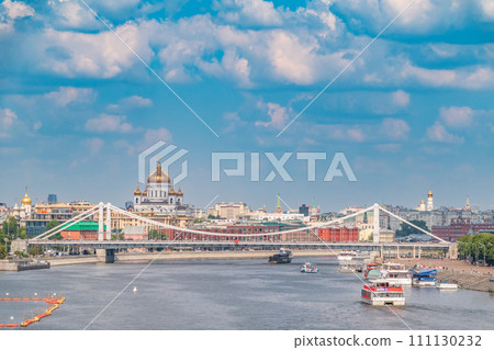 Cruise ship sails on the Moscow river in Moscow city center, popular place for walking. 111130232