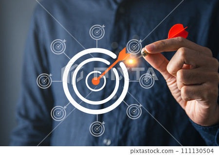 Businessman with goal or target dartboard and loading bar for goal setting in business and strategic plainning achievement concept. Businessman with goal or target dartboard and loading bar for goal setting in business and strategic plainning achievement concept. 111130504