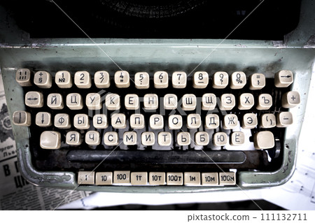 Antique typewriter cyrillic keys close up and russian keys selective focus Antique typewriter cyrillic keys close up and russian keys selective focus 111132711