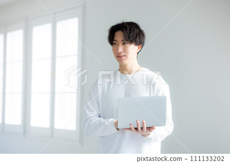 Man using a computer Man using a computer 111133202