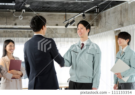 Businessman and worker shaking hands in the office Businessman and worker shaking hands in the office 111133354