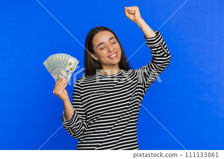 Rich happy woman winner waving money dollar cash like a fan, big income wealth success business Rich happy woman winner waving money dollar cash like a fan, big income wealth success business 111133861
