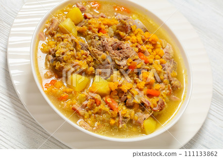 split pea and lentil soup with pork on bones 111133862