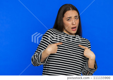 Caucasian woman in striped blouse pointing fingers herself feels innocent not her fault fail mistake 111133900