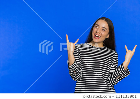 Happy woman showing rock n roll gesture by hands cool sign crazy expression dancing victory win Happy woman showing rock n roll gesture by hands cool sign crazy expression dancing victory win 111133901