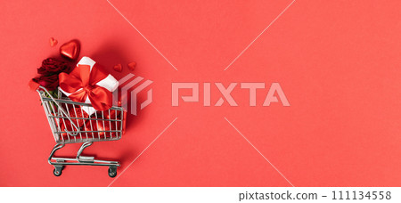 Valentine's day concept. Shopping trolley with gift boxes Valentine's day concept. Shopping trolley with gift boxes 111134558
