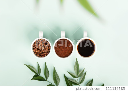 Coffee Trio: Beans, Ground, and Brewed Cup 111134585