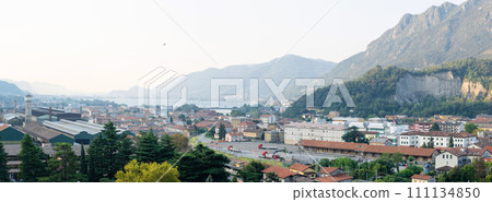 Panoramic view of cityscape Lecco, beautiful view to the city in the mountain valley Panoramic view of cityscape Lecco, beautiful view to the city in the mountain valley 111134850