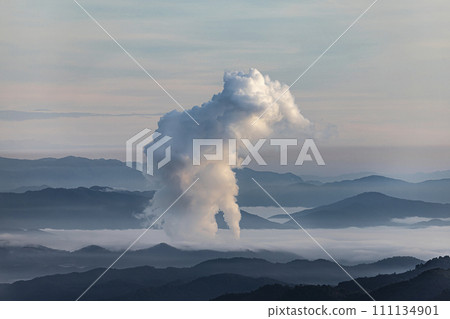 Beautiful morning scenery with fog in the background at Mae Moh Lignite Coal Power Plant, Lampang, Thailand Industrial white vapor from cooling and tower pipes, industrial and environmental themes 111134901