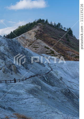 The mountain surface covered with gray-white lava and the desolate hell-like scenery of Kawarage Jigoku in Yuzawa City, Akita Prefecture, Japan 111135216