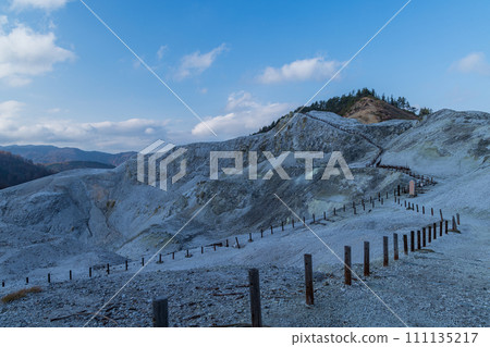 The mountain surface covered with gray-white lava and the desolate hell-like scenery of Kawarage Jigoku in Yuzawa City, Akita Prefecture, Japan 111135217