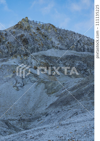 The mountain surface covered with gray-white lava and the desolate hell-like scenery of Kawarage Jigoku in Yuzawa City, Akita Prefecture, Japan The mountain surface covered with gray-white lava and the desolate hell-like scenery of Kawarage Jigoku in Yuzawa City, Akita Prefecture, Japan 111135225