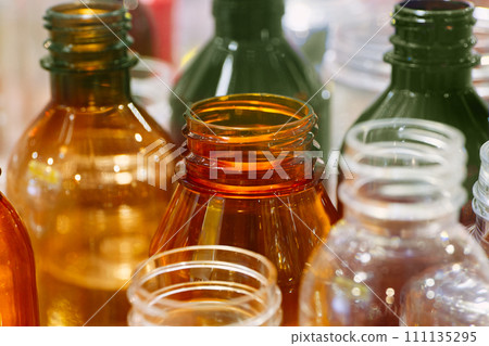 Empty multicolor transparent plastic bottles 111135295