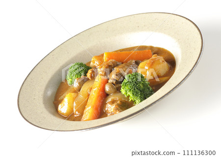 Beef stew with many ingredients such as broccoli, carrots, and shimeji mushrooms is photographed against a white background. Beef stew with many ingredients such as broccoli, carrots, and shimeji mushrooms is photographed against a white background. 111136300