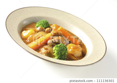 Beef stew with many ingredients such as broccoli, carrots, and shimeji mushrooms is photographed against a white background. 111136301