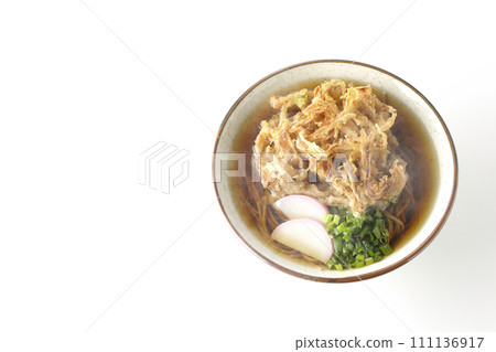 An overhead shot of piping hot kakiage soba or tempura soba topped with fish cake and onions against a white background An overhead shot of piping hot kakiage soba or tempura soba topped with fish cake and onions against a white background 111136917