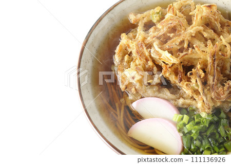An overhead shot of piping hot kakiage soba or tempura soba topped with fish cake and onions against a white background An overhead shot of piping hot kakiage soba or tempura soba topped with fish cake and onions against a white background 111136926