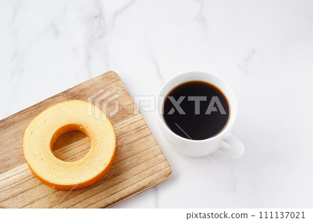 Snack time with German cake Baumkuchen and coffee Snack time with German cake Baumkuchen and coffee 111137021