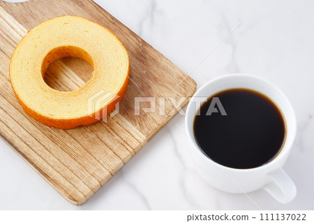 Snack time with German cake Baumkuchen and coffee Snack time with German cake Baumkuchen and coffee 111137022