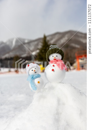 Ski resort and snowman pair 111137072