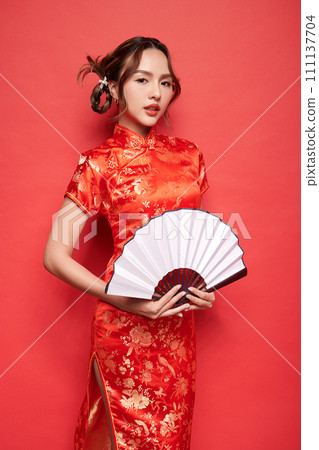 Asian chinese woman in traditional dress on red background. Chinese new year festival, Asian chinese woman in traditional dress on red background. Chinese new year festival, 111137704