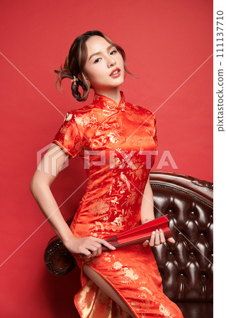 Asian chinese woman in traditional dress on red background. Chinese new year festival, Asian chinese woman in traditional dress on red background. Chinese new year festival, 111137710