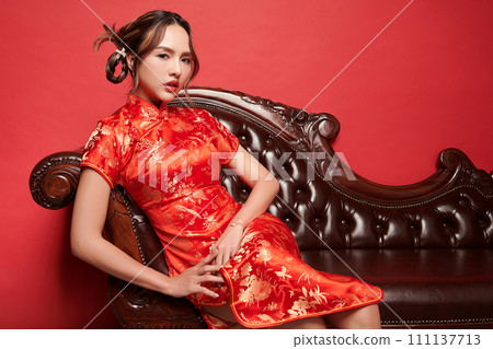 Asian chinese woman in traditional dress on red background. Chinese new year festival, Asian chinese woman in traditional dress on red background. Chinese new year festival, 111137713