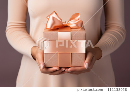 Female hands with gift box, close-up 111138958