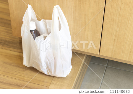 Image of plastic bags filled with food placed at the entrance 111140683