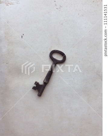 antique key placed on old paper antique key placed on old paper 111141531