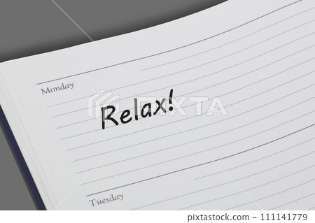 Relax reminder message in an open diary Relax reminder message in an open diary 111141779