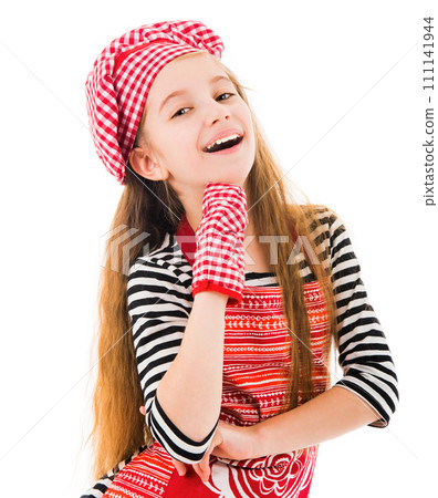 Little positive girl in red apron and red baking glove waving isolated on white background 111141944
