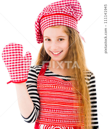 Little positive girl in red apron and red baking glove waving isolated on white background 111141945