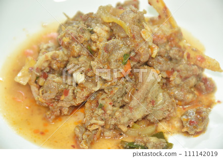 spicy stir fried slice  beef meat with sweet chili paste on plate   111142019